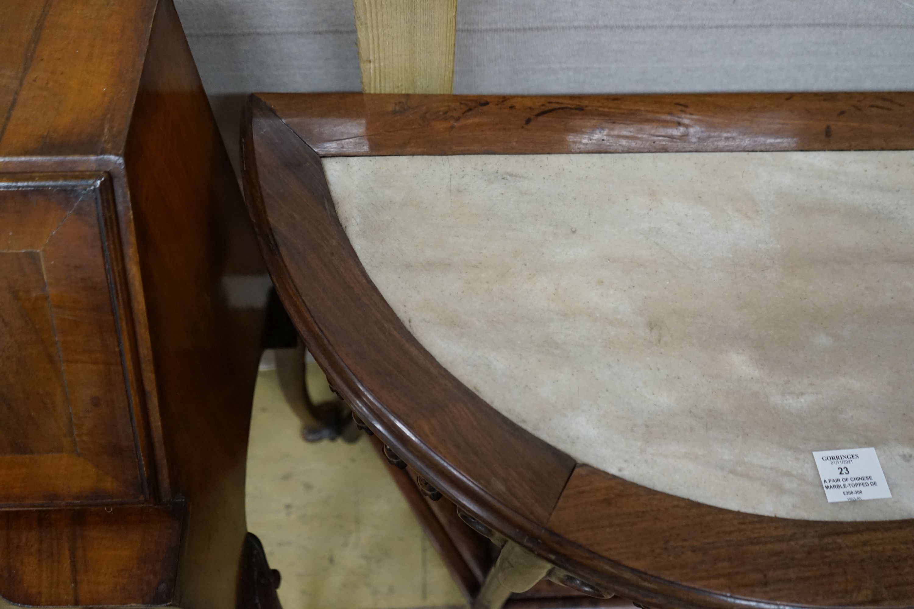 A pair of Chinese marble-topped demi lune console tables, width 82cm, depth 40cm, height 80cm